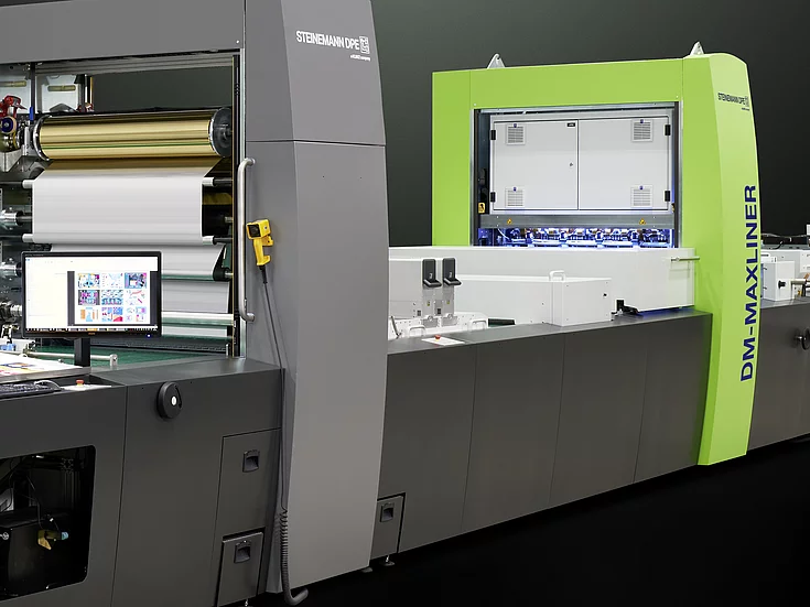 Kurz Digital Embellishement Solution with gray and green components labeled "STEINEMANN DPE" and "DM-MAXLINER," used for high-speed spot coating and metallization.