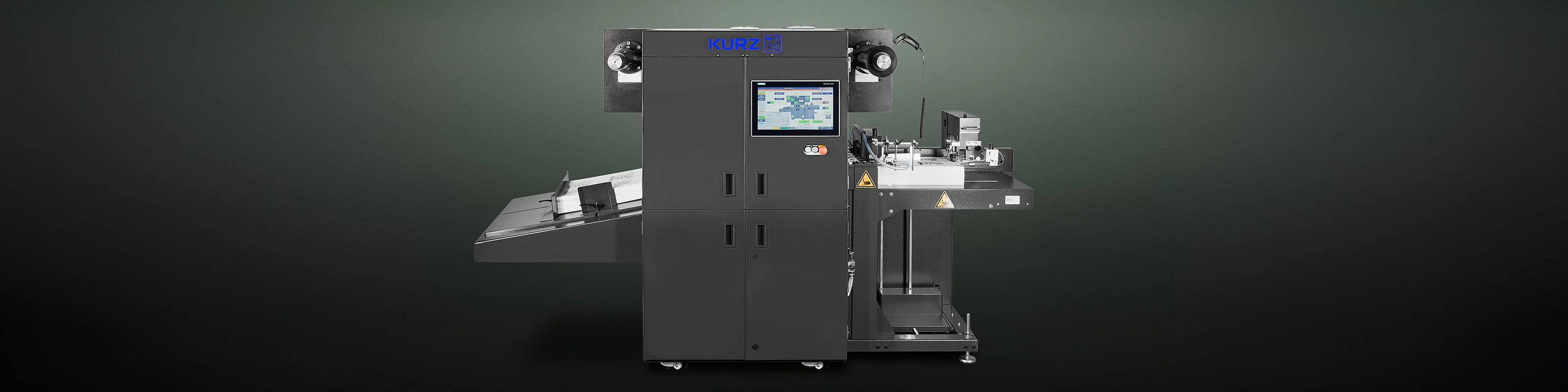 Digital Embellishment Solution from KURZ with open compartment, processing stacked printed sheets labeled "VIP".