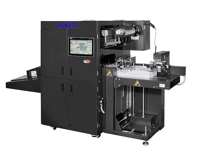 black Kurz machine with touchscreen control panel, used for industrial printing or finishing processes, isolated on white background.