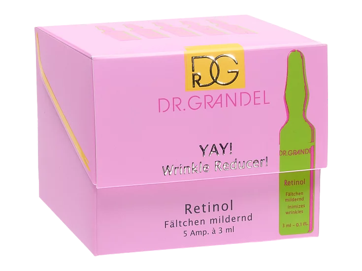 Pink box for Dr. Grandel’s ‘YAY! Wrinkle Reducer!’ Retinol product, showing text in English and German and an illustration of a green ampoule.