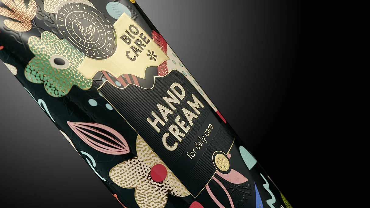 Close-up of a colorful hand cream bottle label with floral designs and text "BIO CARE HAND CREAM for daily care."