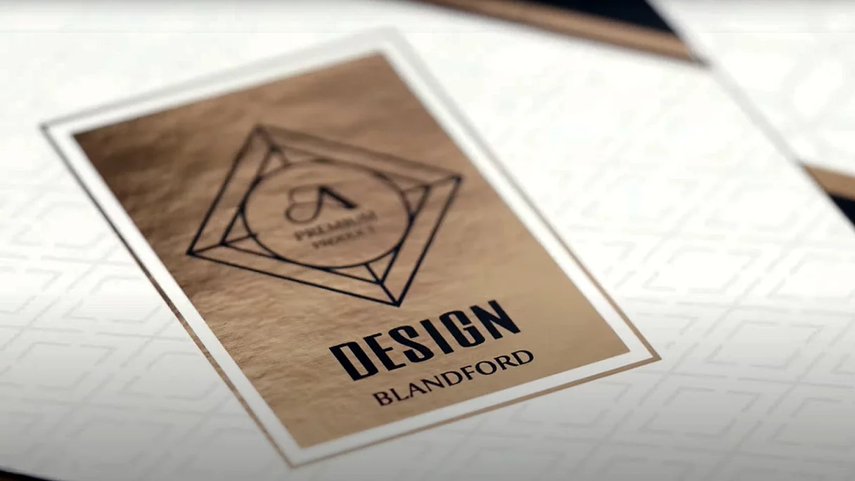 Label design with a geometric diamond-shaped frame, metallic gold background, and bold black text reading "DESIGN BLANDFORD," featuring a circular logo with a stylized "A" and "PALMARII PROJECT" inside.