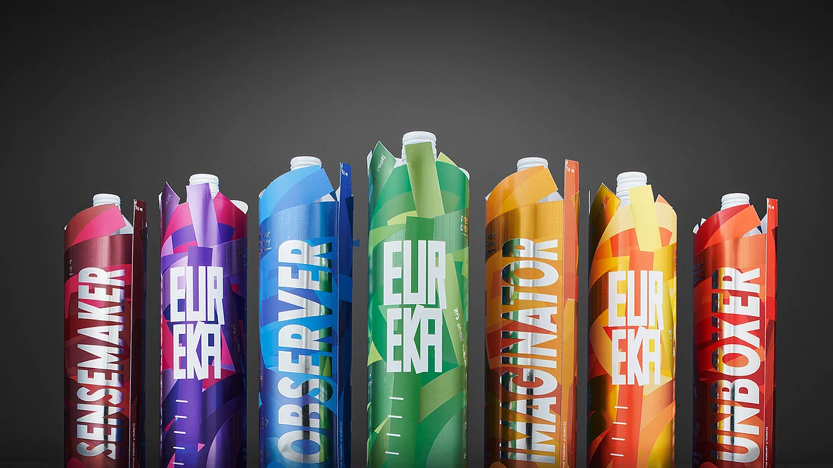 Colorful beverage-style packaging tubes with bold typography and creative names like Sensemaker, Observer, Imaginator, and Unboxer, showcasing KURZ’s advanced printing and finishing techniques.
