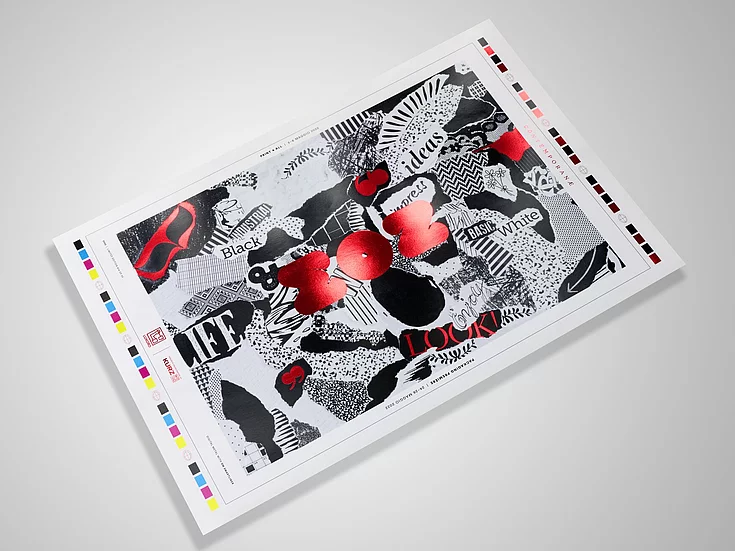 Single art print lying on a gray surface, featuring abstract black, white, and red shapes with some text and color bars along the edges.
