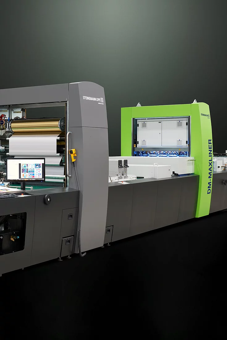 Kurz Digital Embellishement Solution with gray and green components labeled "STEINEMANN DPE" and "DM-MAXLINER," used for high-speed spot coating and metallization.