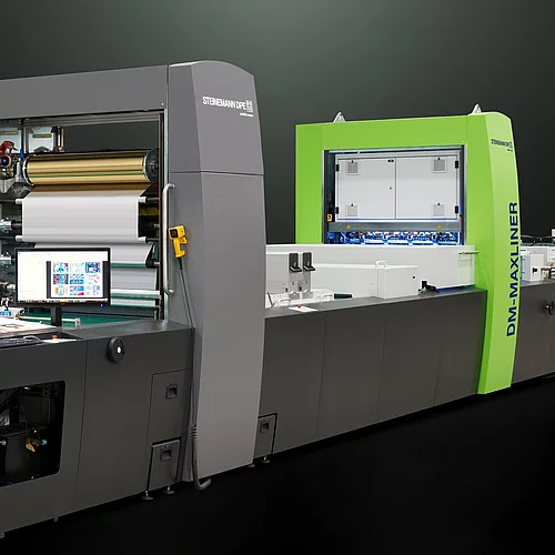Kurz Digital Embellishement Solution with gray and green components labeled "STEINEMANN DPE" and "DM-MAXLINER," used for high-speed spot coating and metallization.