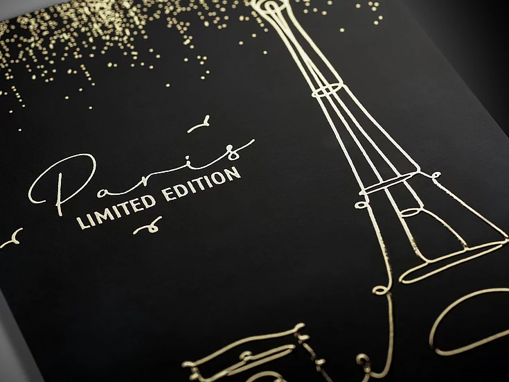 Black cover with gold foil line drawing of the Eiffel Tower and the text “Paris LIMITED EDITION” in elegant script and block letters.