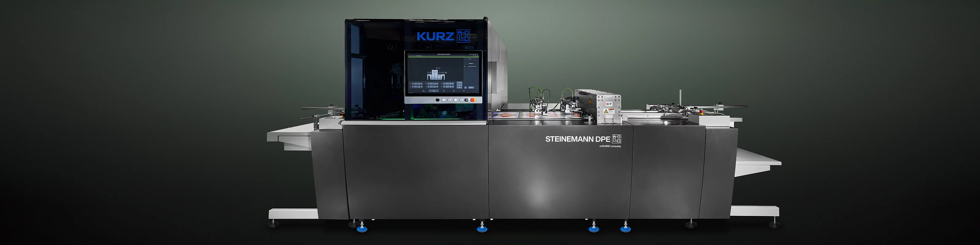 High-tech KURZ digital embellishment machine with touchscreen and colorful printed material.